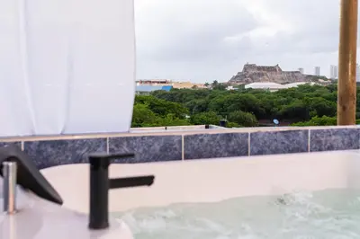 a bathroom with a sink and a view of the acropolis at Cartagena Apartamento in Cartagena de Indias