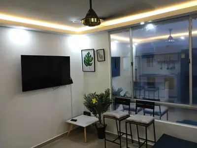 a living room with a flat screen tv on a wall at Espectacular apartamento amoblado en BARRANQUILLA in Barranquilla