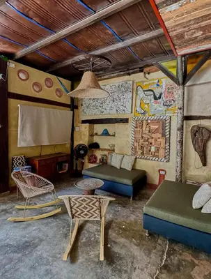a living room with a couch and a table at Casa del Tunel Lodge in Getsemani in Cartagena de Indias