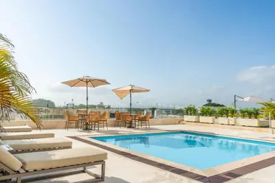 a swimming pool on the roof of a building at Ocean View ApartaSuite 16th Floor in Cartagena de Indias