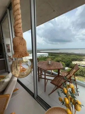 a balcony with a table and a view of the ocean at Sea view with private balcony in Cartagena de Indias