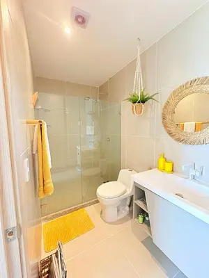 a bathroom with a toilet and a sink and a shower at Sea view with private balcony in Cartagena de Indias