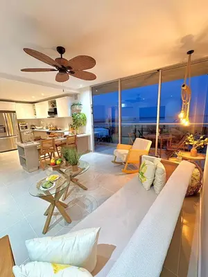 a living room with a couch and a table at Sea view with private balcony in Cartagena de Indias