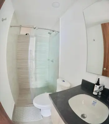 a bathroom with a sink and a toilet and a shower at Hermoso apartamento serena del mar #1 in Puerto Tierrabaja
