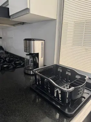 a dish drying rack on a counter in a kitchen at Apartamento diagonal a bv norte in Barranquilla
