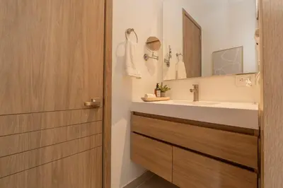 a bathroom with a sink and a mirror at BK2L | Escápate a Baía Kristal, sol + arena blanca in Los Arrayanes