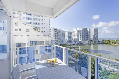 a balcony with a table and a view of the water at Riviera Exclusive - Apartamento con vista al mar in Cartagena de Indias