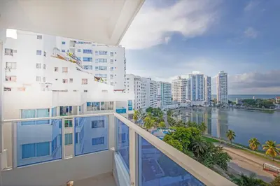 a balcony with a view of the ocean and buildings at Riviera Exclusive - Apartamento con vista al mar in Cartagena de Indias