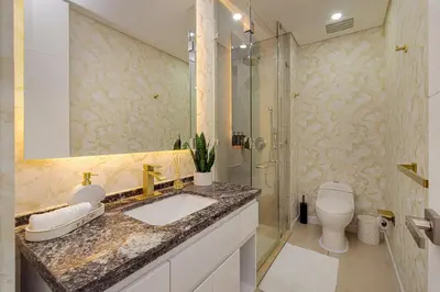 a bathroom with a sink and a shower and a toilet at Luxury Ocean View Apartment Building H2 - Hyatt in Cartagena de Indias