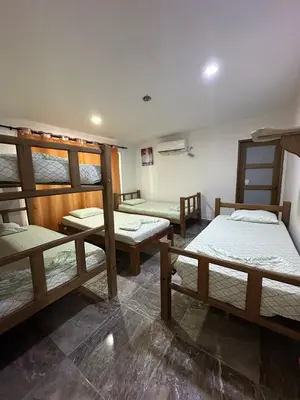 a room with four bunk beds in it at Casa Blanca in Coveñas