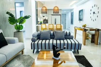 a living room with a couch and a table at Luxury Apartment BayView Jacuzzi Guestfriendly in Cartagena de Indias