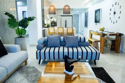 a living room with a couch and a table at Luxury Apartment BayView Jacuzzi Guestfriendly in Cartagena de Indias
