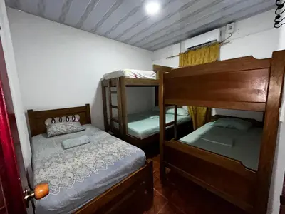 a small room with two bunk beds in it at Cabañas villa Ángela in Coveñas