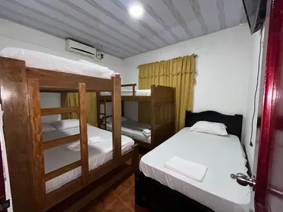 a bedroom with two bunk beds in a room at Cabañas villa Ángela in Coveñas