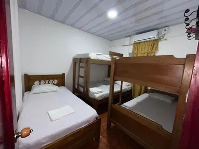 a small room with two bunk beds in it at Cabañas villa Ángela in Coveñas