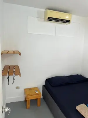 a bedroom with a bed and a table on the wall at Habitación cerca a la playa 205 in Cartagena de Indias