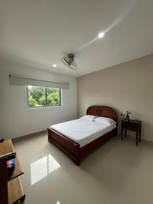 a bedroom with a bed and a window at Apto Caribe Mar in Coveñas
