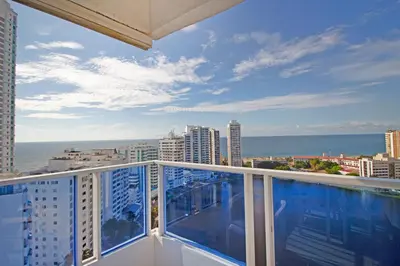 a balcony with a view of the ocean and buildings at Riviera Beach - Apartamento con vista al mar in Cartagena de Indias