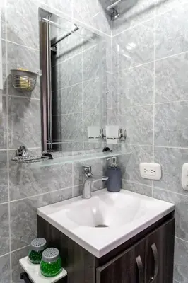 a bathroom with a sink and a mirror at Apt luxury near sea wifi Ac pool at Cartagena in Cartagena de Indias