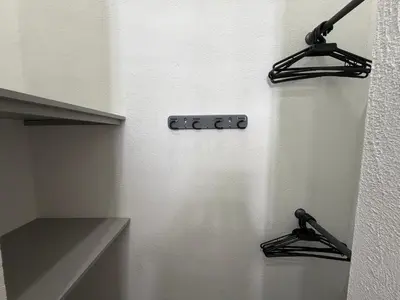 a kitchen with two hangers on a wall at Atardeceres casa de playa in Cartagena de Indias