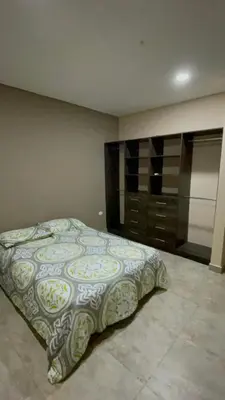 a bedroom with a bed and a dresser at Cabaña Belmar House in Puerto Salgar