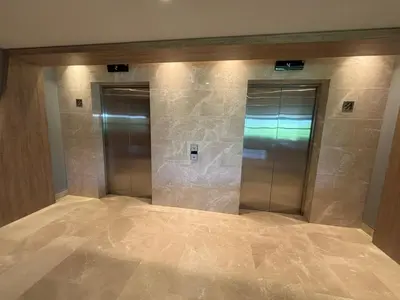 an elevator lobby with two elevators in a building at Beachfront Stay Morros EOS in Cartagena de Indias