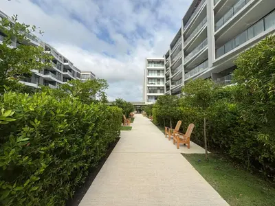 a sidewalk in front of a building with benches at Beachfront Stay Morros EOS in Cartagena de Indias