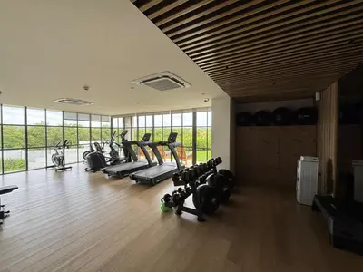 a gym with a bunch of treadmills and machines at Beachfront Stay Morros EOS in Cartagena de Indias