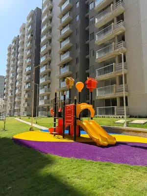 a playground with a slide in a park at Luxury Apartments in Barranquilla