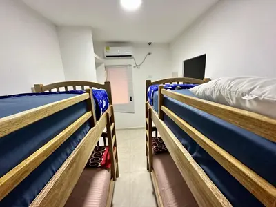 a room with three bunk beds in a room at Casa Murillo Toro in Cartagena de Indias