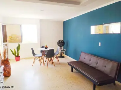a living room with a couch and a table at alojamiento frente mar 11 in Cartagena de Indias
