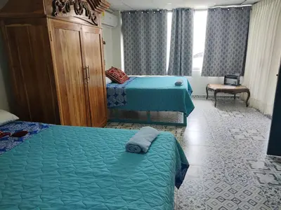 a hotel room with two beds in a room at Acantilado getsemani recomendado para familias in Cartagena de Indias