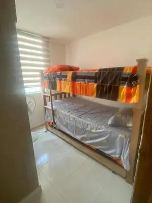 a small bedroom with a bunk bed in it at Apartamento acogedor y económico in Barranquilla