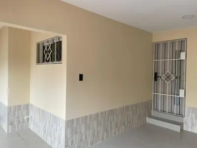 an empty room with two windows and a wall at Apartaestudio Barranquilla in Barranquilla