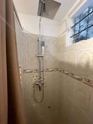 a bathroom with a shower with a shower head at Apartaestudio Barranquilla in Barranquilla