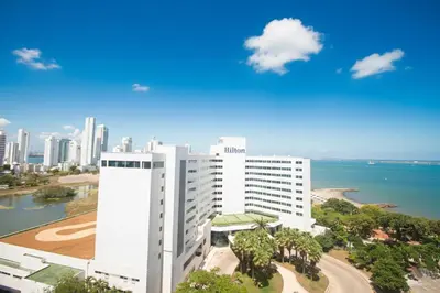 a large white building next to the ocean at Riviera del Mar - Apartamento con vista panorámica al mar in Cartagena de Indias