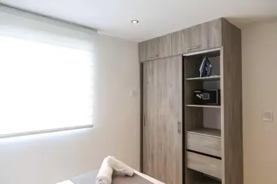 a room with a book shelf and a cabinet at Luxury apartment with sea view in Cartagena de Indias