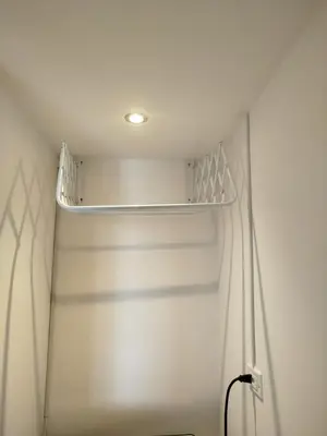 a white closet with a shelf in the ceiling at Luxury apartment with sea view in Cartagena de Indias