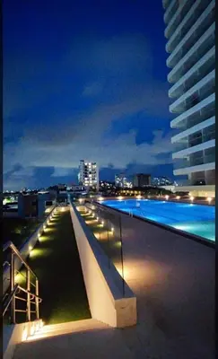a swimming pool on top of a building at night at Exclusive apartment Cartagena in Cartagena de Indias