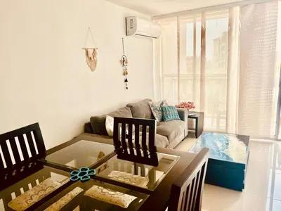a living room with a coffee table and a couch at Playa Azul in Puerto Colombia
