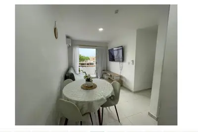 a dining room with a table and some chairs at apartamento lindo in Cartagena de Indias