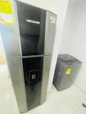 a refrigerator and a trash can in a room at apartamento lindo in Cartagena de Indias