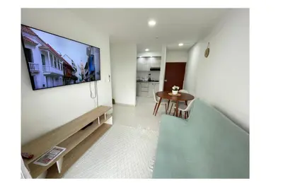 a living room with a flat screen tv on a wall at apartamento lindo in Cartagena de Indias