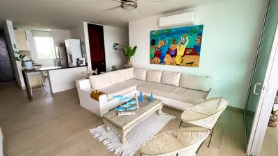 a living room with a white couch and chairs at Magico Apartamento Frente al Mar 3 Habitaciones MSC64 in Coveñas