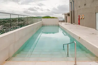 a swimming pool on the roof of a building at Apto Luxury Cartagena 7 minutos a pie de la playa in Cartagena de Indias