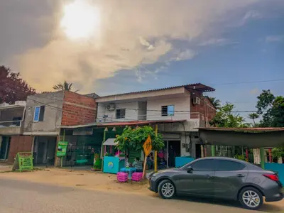 a car parked in front of a building at Hostal berpé in Coveñas