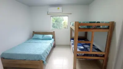 a small bedroom with a bunk bed and a ladder at Hostal berpé in Coveñas
