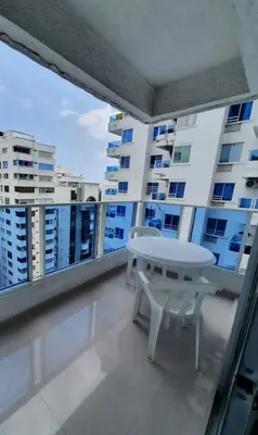 a balcony with a table and a view of a building at Apartamento con balcon p13 in Cartagena de Indias