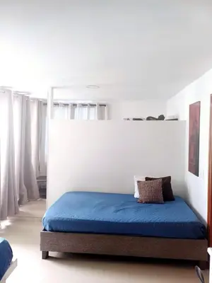 a bed with a blue mattress in a room at Apartamento con balcon p13 in Cartagena de Indias