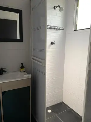 a bathroom with a shower and a sink at Hostal pura vida in San Bernardo del Viento